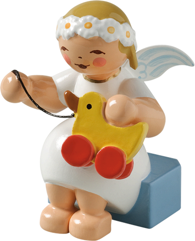 Marguerite Angel sitting with Toy Duck