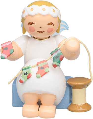Marguerite Angel Sitting with Advent Calendar