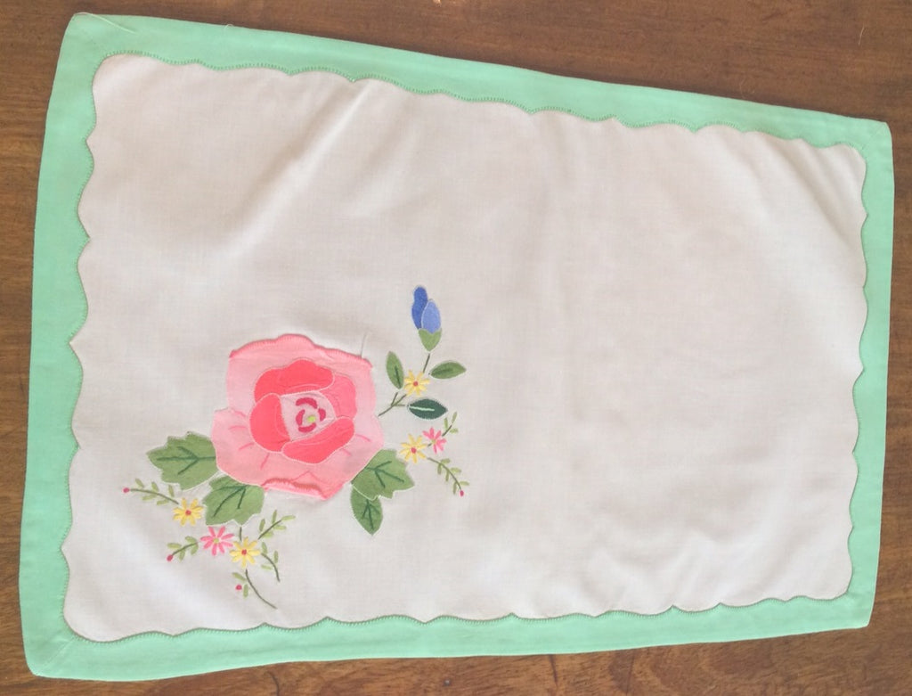 Placemats and Napkins:  Rectangular, white with rose applique and green appliqued scalloped border