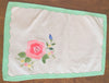 Placemats and Napkins:  Rectangular, white with rose applique and green appliqued scalloped border