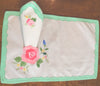 Placemats and Napkins:  Rectangular, white with rose applique and green appliqued scalloped border