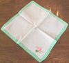 Placemats and Napkins:  Rectangular, white with rose applique and green appliqued scalloped border