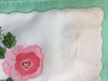 Placemats and Napkins:  Rectangular, white with rose applique and green appliqued scalloped border
