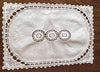 Placemats and Napkins:  White oval embroidered linen placemats set in rectangular border of French lace